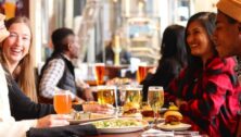 Customers enjoying a meal inside an Iron Hill Brewery.