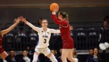 Lucy Olsen as a point guard during a Villanova Wildcats basketball game.