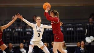 Lucy Olsen as a point guard during a Villanova Wildcats basketball game.