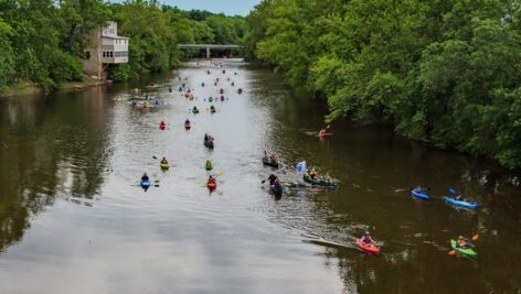 An aerial view of people enjoying recreational fun in the Perkiomen Creek.