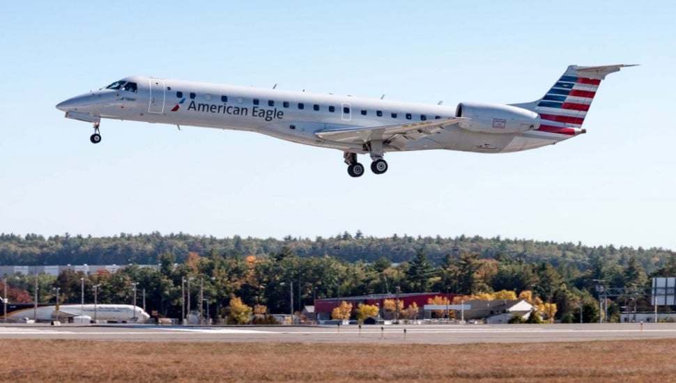 A Piedmont Airlines aircraft takes off from an unknown destination.