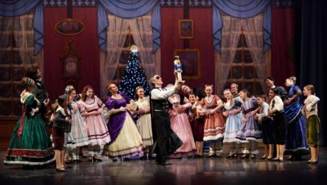 Brandywine Ballet costumed performers on stage in a scene from "The Nutcracker."