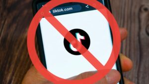 A banned symbol appears over a phone's TikTok app.