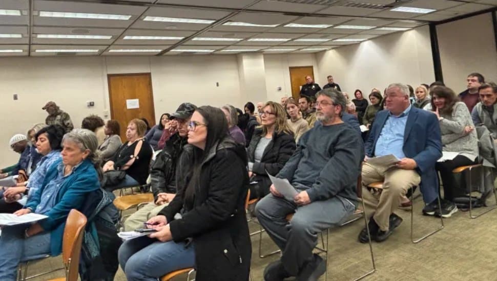 A packed county council meeting room.