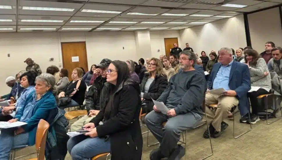 A packed county council meeting room.