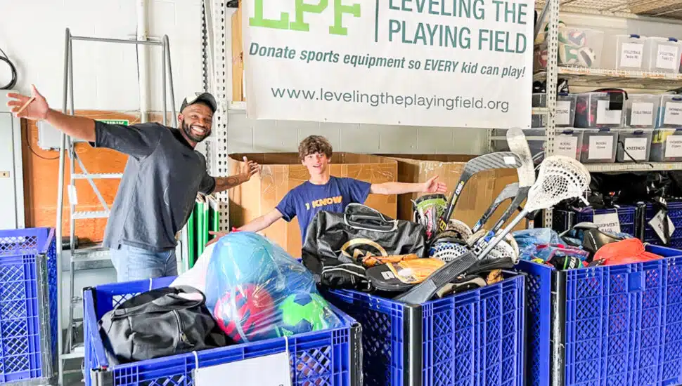 Level the Playing Field sets up tables of donated sports equipment.