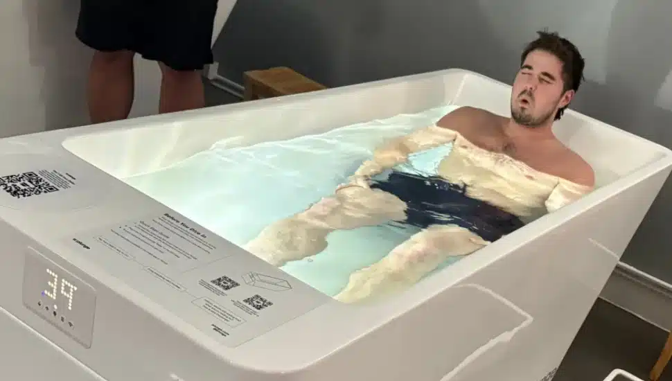 A customer experiences cold water immersion at Cold Plunge Philly in Havertown.