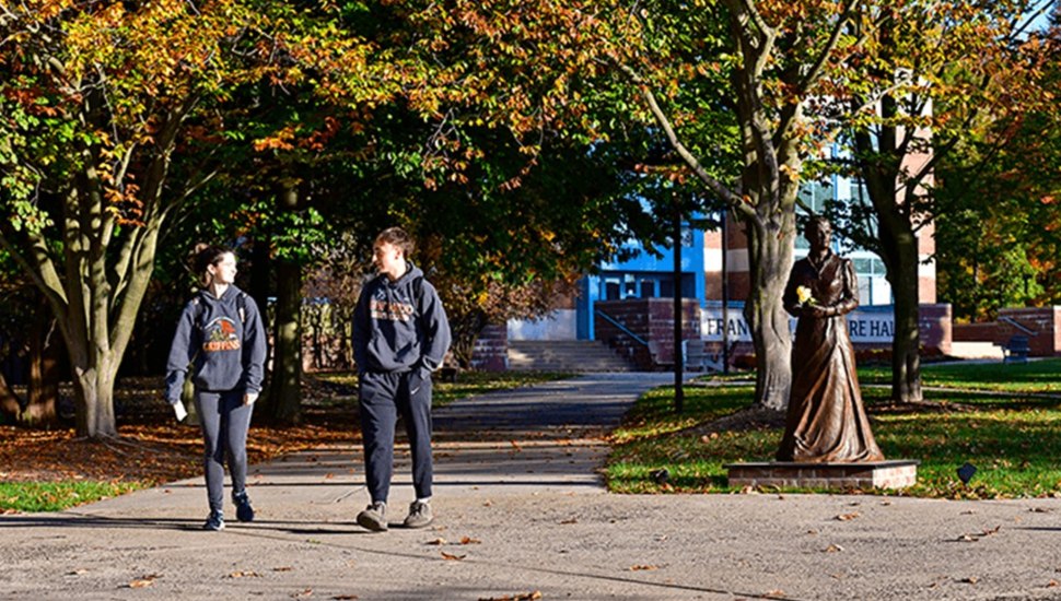 Students walking on a college campus.