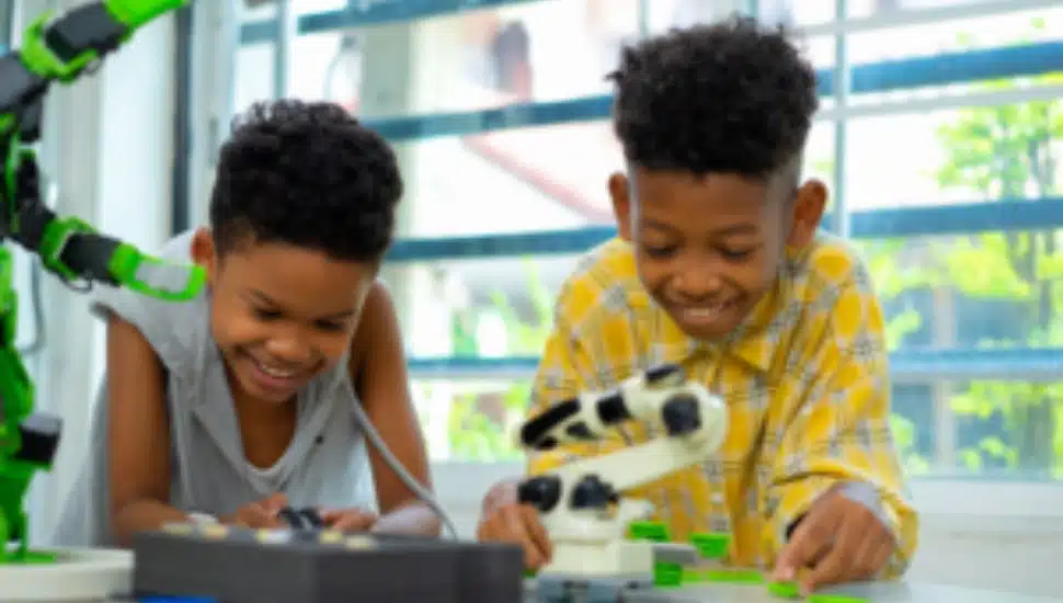 Two boys engaged in a hands-on project.