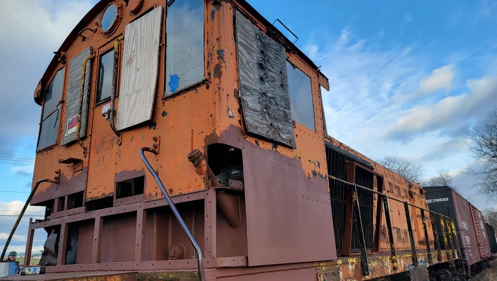 An old locomotive standing idle.
