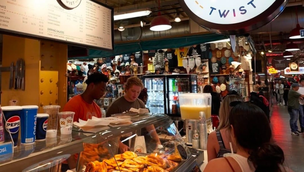Customers order from a food vendor in Reading Terminal.