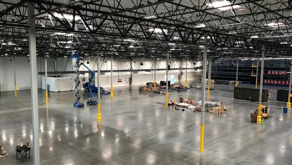 Wide-angle view of an empty warehouse.