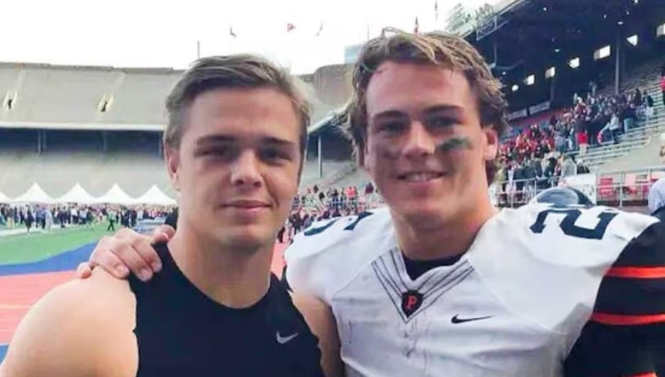 Friends and former Princeton University football players Tiger Bech (left) and Ryan Quigley (right) pose for a photo.
