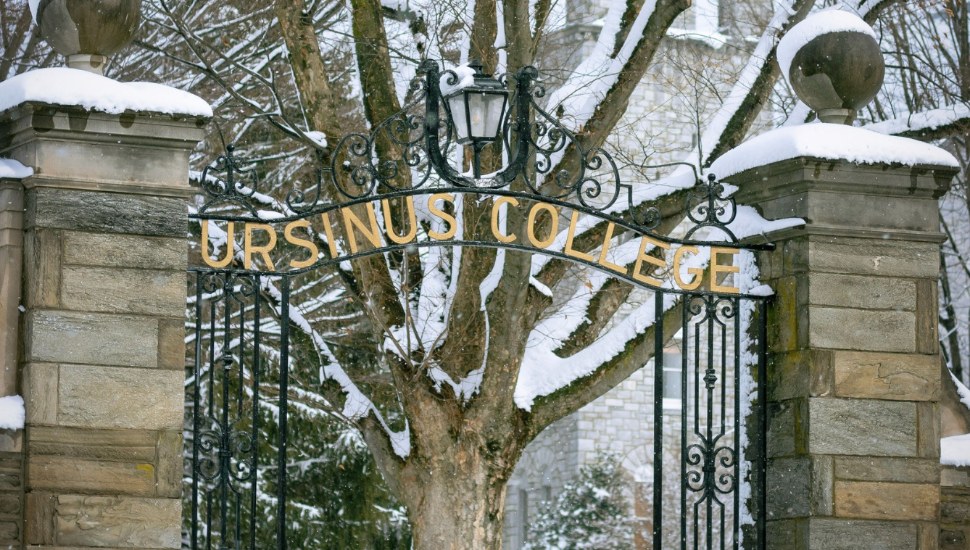 The entryway, with sign, to Ursinus College in winter.