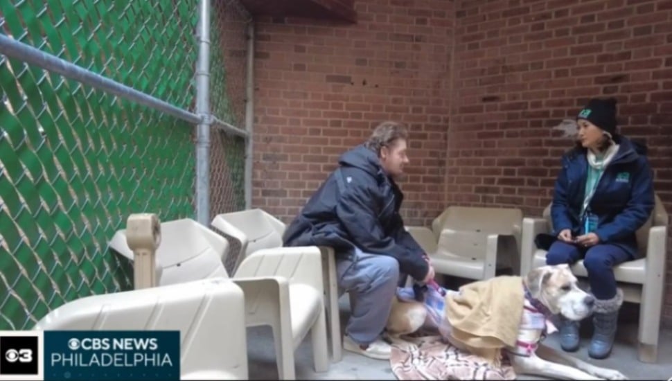 Aaron Kohlenberger on the streets of Upper Darby with his dog talking with CABS News Philadelphia reporter Madeline Wright.