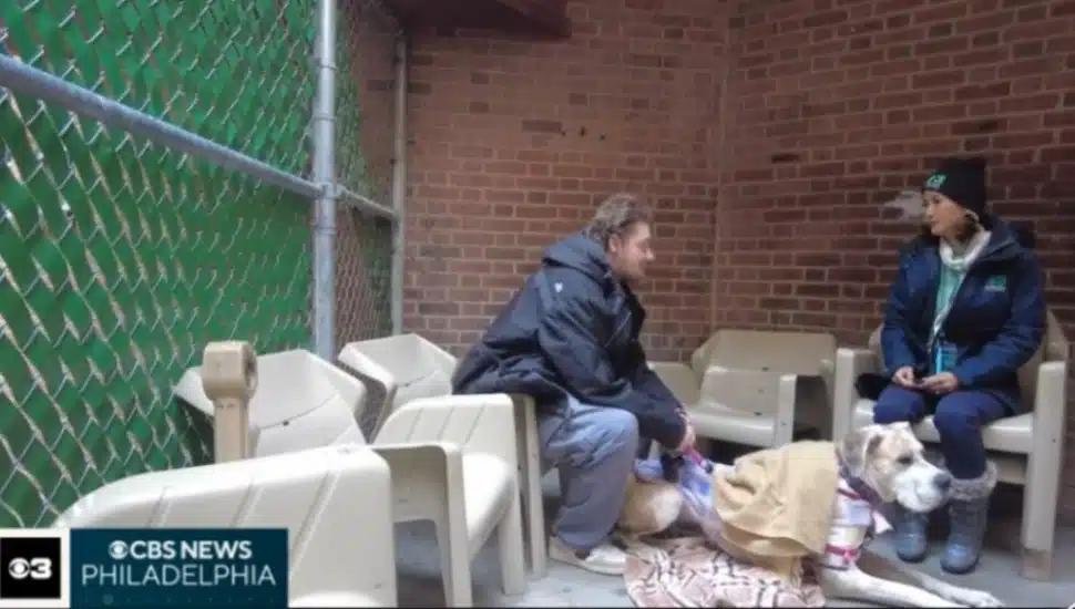 Aaron Kohlenberger on the streets of Upper Darby with his dog talking with CABS News Philadelphia reporter Madeline Wright.