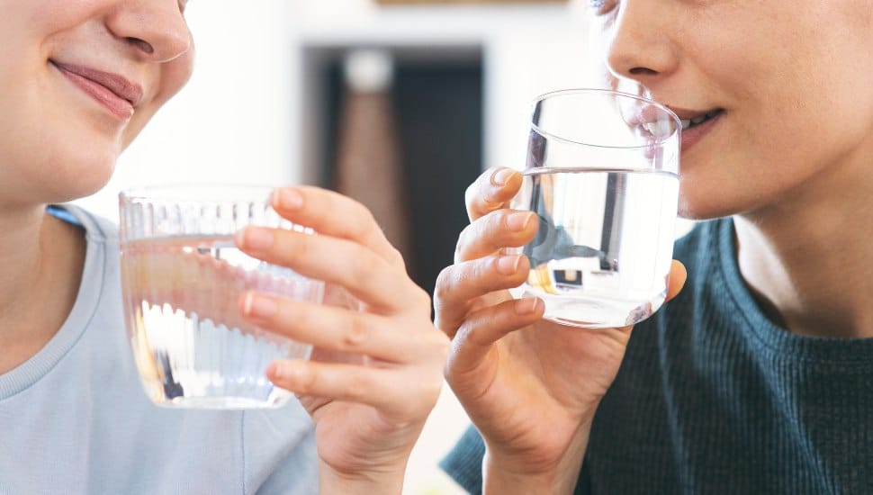 Friends drinking a fresh glass of water.
