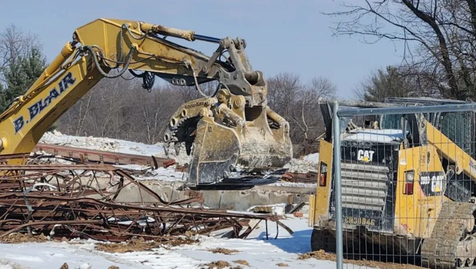 Demolition and construction equipment at the Quality Inn Hotel in West Goshen.