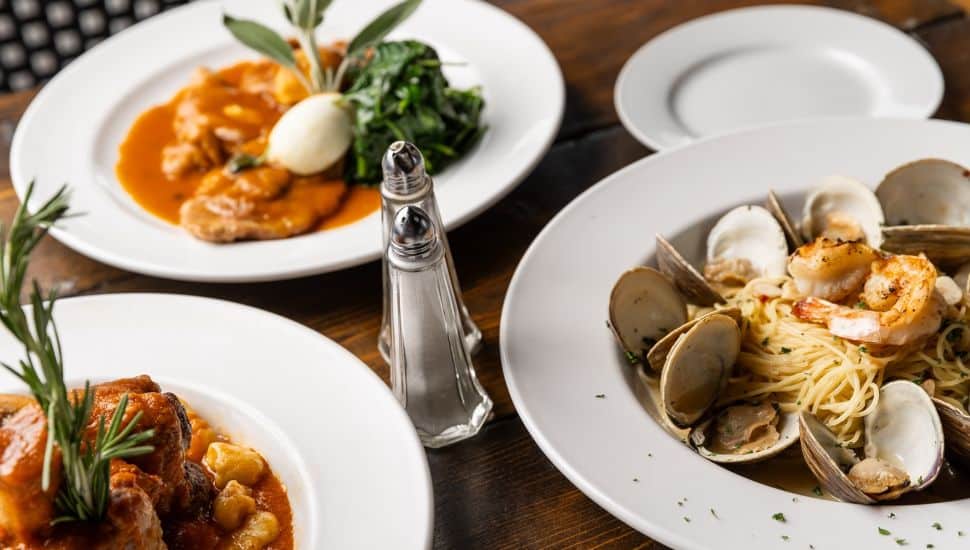 Italian dishes are on display on a restaurant table.