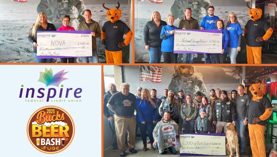 Three charities receive giant checks from beer festival.