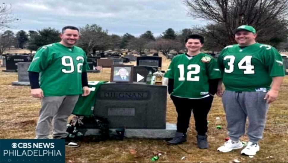 The Diegnan’s—Kevin Jr., Dan and Dan’s son Dan, at the grave site of Kevin Diegnan in SS. Peter and Paul Cemetery in Springfield.
