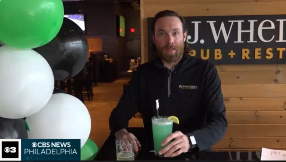 P.J. Wheilhan's Pub +Restaurant General Manager Brandon Foley with two Eagles-themed drinks.