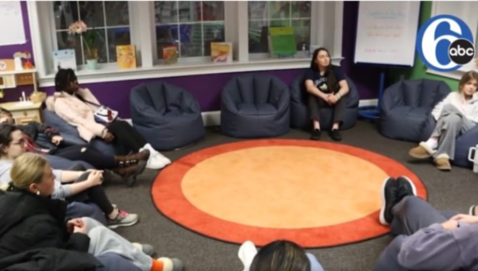 Young teens sit in a circle during a grief support group session at Peter's Place in Radnor.