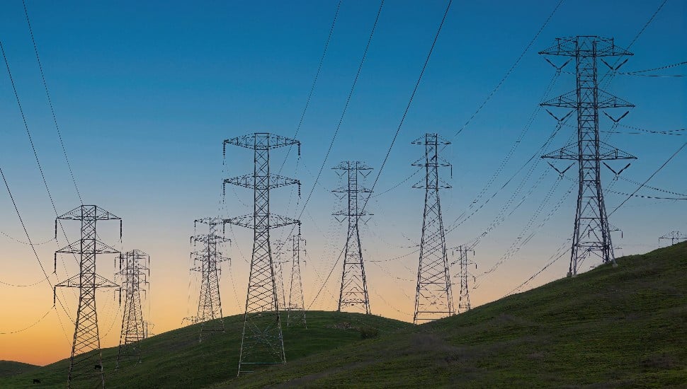 High tension towers at sunset.