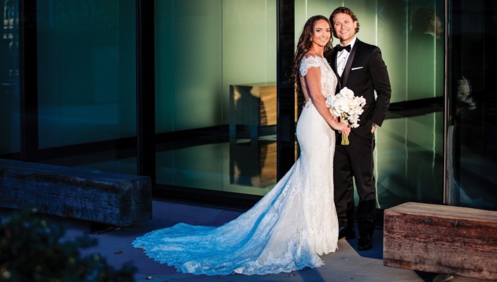 Rebecca Feinstein and Jeffrey Miller in wedding attire at their speakeasy wedding.