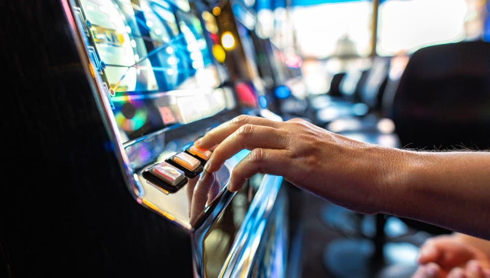 A person is playing a skill game machine.