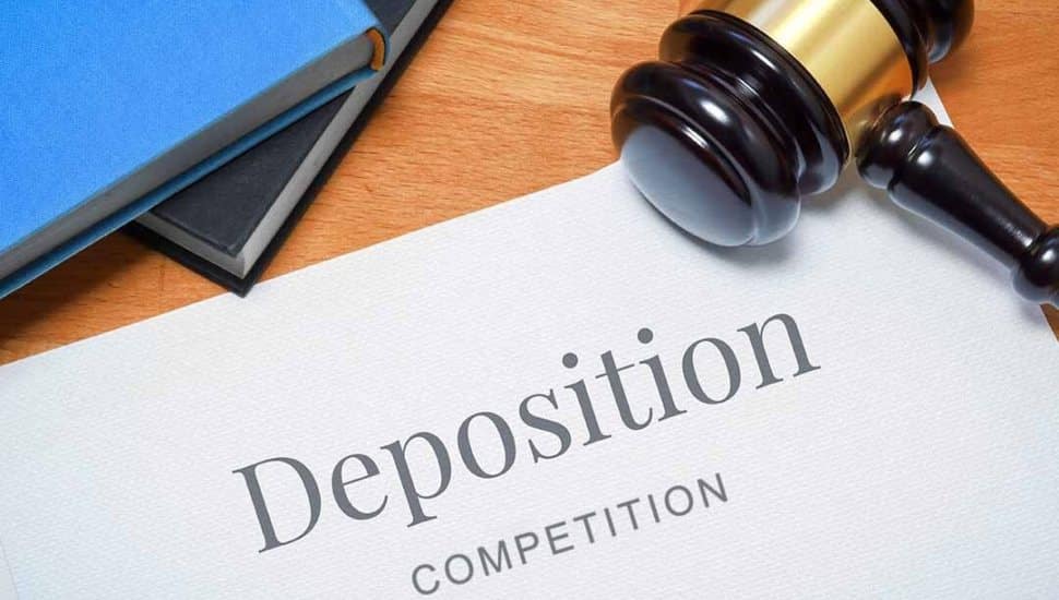 A paper with the word "Deposition" with a gavel on top.