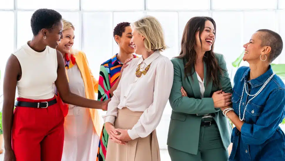 Business women in a casual group enjoying a networking event.