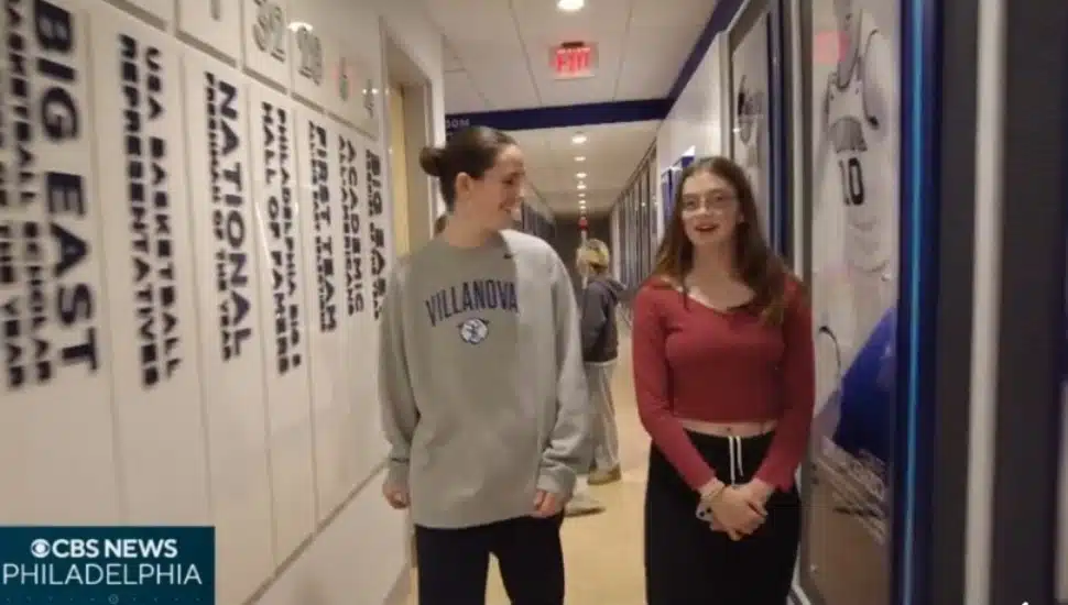 Villanova Women's Basketball team member Annie Welde talks with Radnor Middle School eighth-grader Leah Humphrey.
