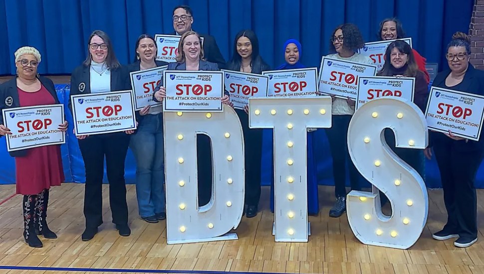 Southeast Delco teachers hold protest signs during a rally at Darby Township Elementary School.