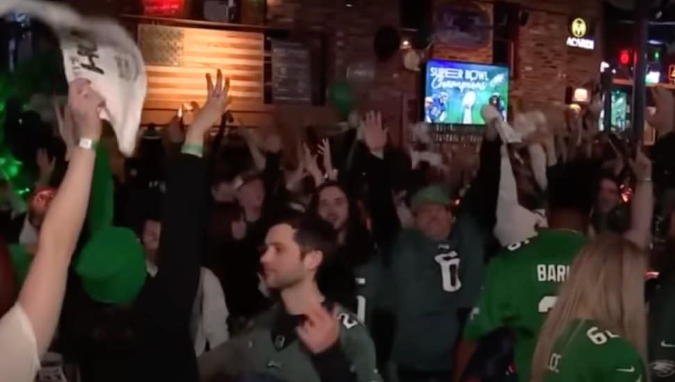 Eagles fans in a bar watching the Super Bowl.