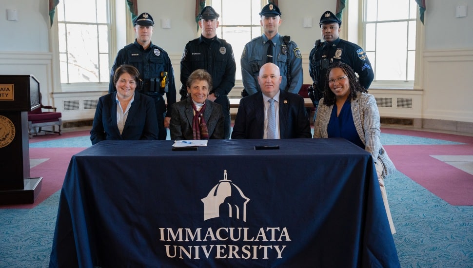 Pictured L-R seated: Kristi Ringen, Vice President for Academic Affairs and Provost at Immaculata; Barbara Lettiere, President of Immaculata; Christopher D. Eiserman, President Delaware County FOP Lodge #27, Deputy Chief of Police Folcroft, and Dr. Monica Taylor, Delaware County Council President. Officers standing, from L to R: Sergeant David Ditrolio, Springfield Township Police; Officer Christopher Dorman, Folcroft Police; Officer James Williams, Sharon Hill Police; Corporal Derrick Raymond, Darby Borough Police.