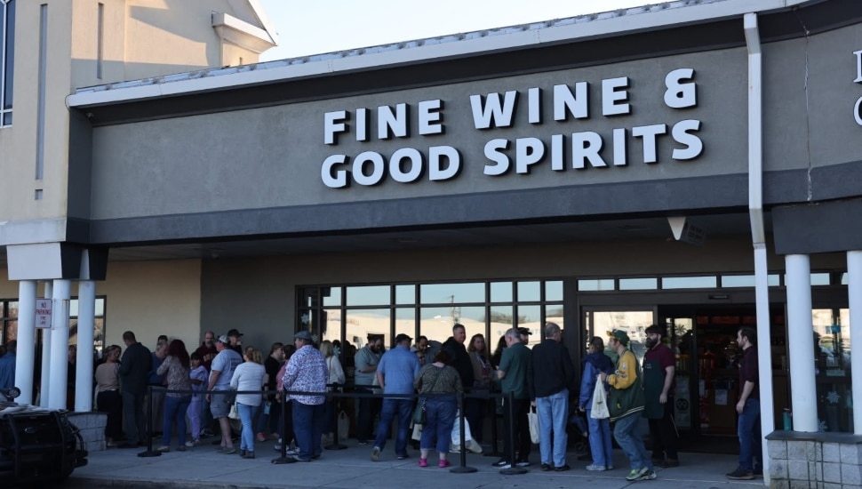 The sign and outside entrance to a state liquor store.