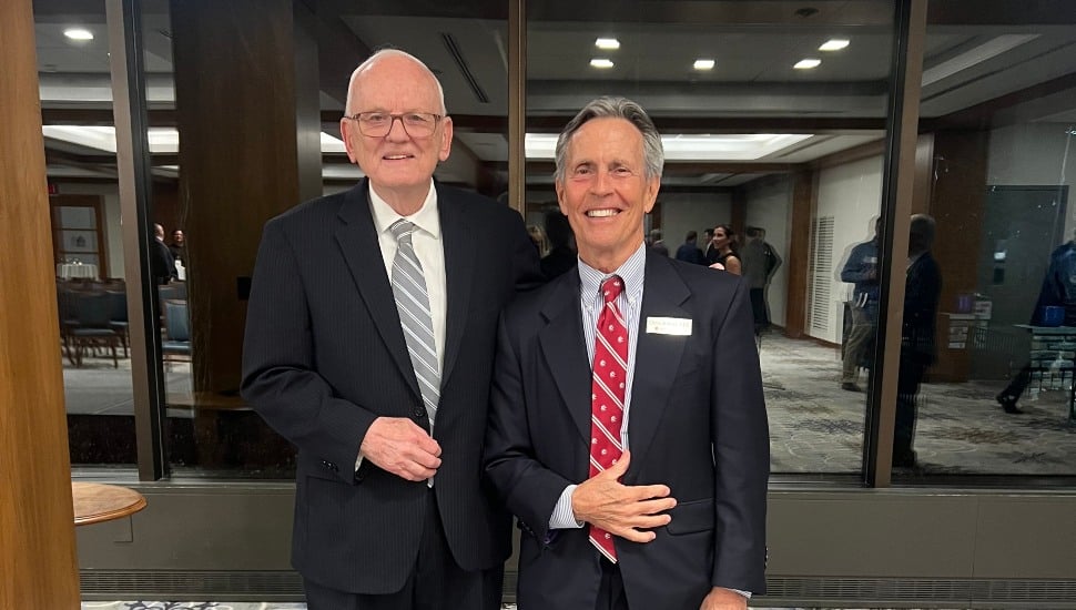 CEO Series guest speaker, former CIA Chief Jim Olson (left) stands with Meridian Bank founder, president, CEO, and chairman of the Board Chris Annas.