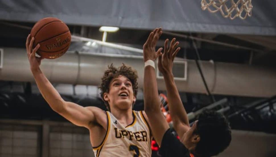An Upper Moreland basketball player in action on the court.
