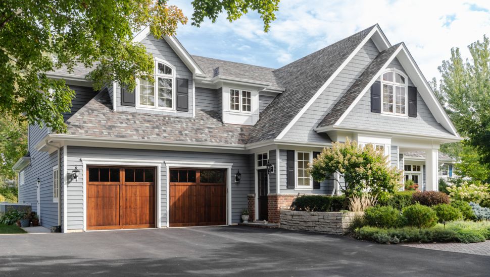 Looking at the outside of a nice suburban home.
