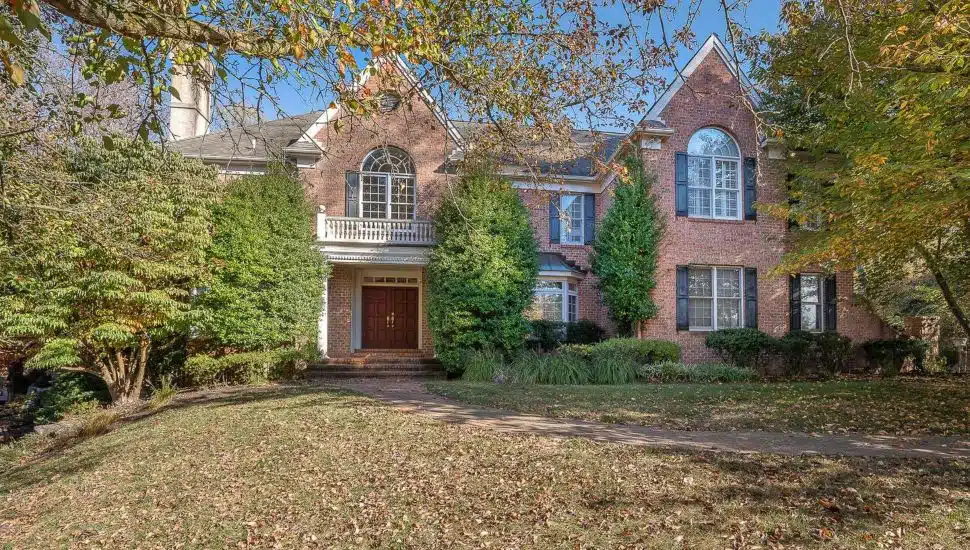 This traditional brick Colonial at 107 Leighton Drive in Bryn Mawr is for sale.