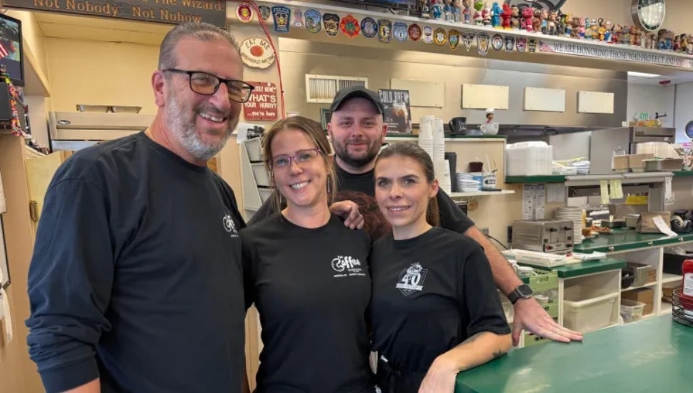 The owner, John Paciotti, and his team.