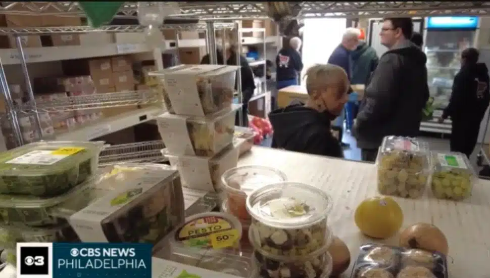 A scene from inside Murphy's Giving Market in Upper Darby showing stocked food on shelves and shoppers walking around.