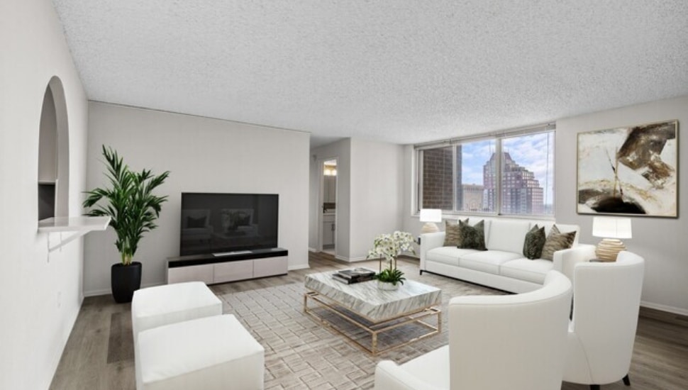 A newer-looking Philadelphia apartment with carpeting and furniture
