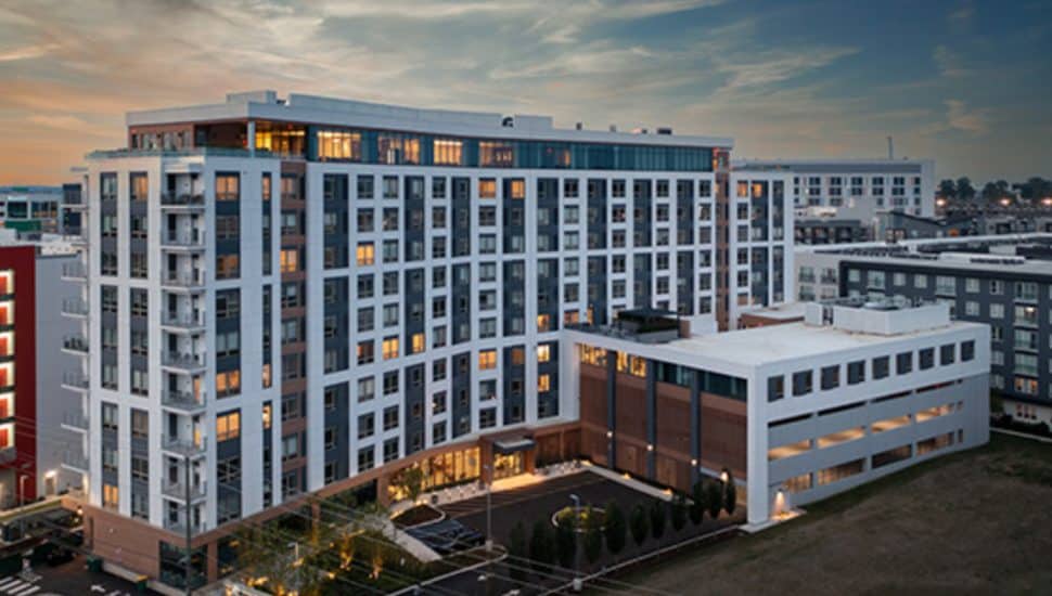 The 11-story senior living building Anthony Senior Living at twilight.