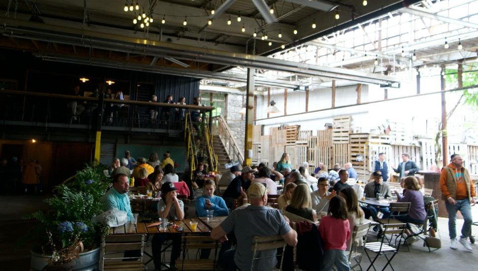Crowds of customers sit inside the Creamery of Kennett Square.