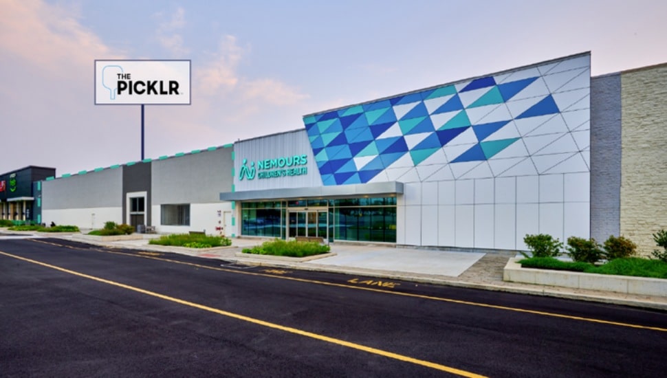 A drawing showing a building, sign and roadway, indicating what the new pickleball facility ,The Picklr, will look like in Broomall.