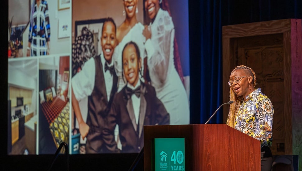Clissita Daniels speaking at a podium.
