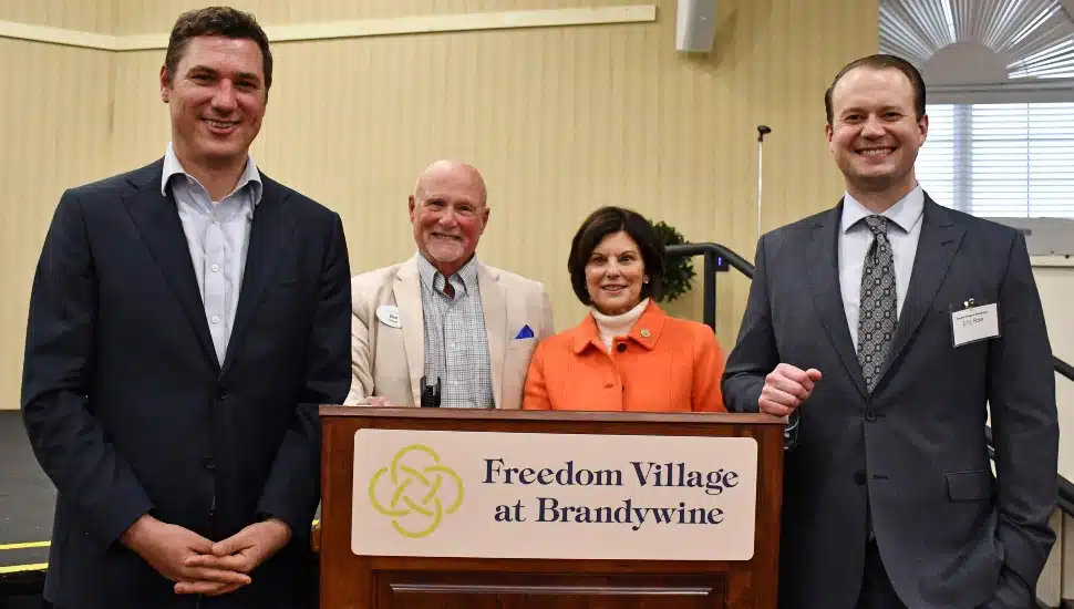 Freedom Village resident and community liaison Ben LaGarde (second from left) stands with Chester County Commissioners Josh Maxwell, Marian Moskowitz, and Eric Roe.