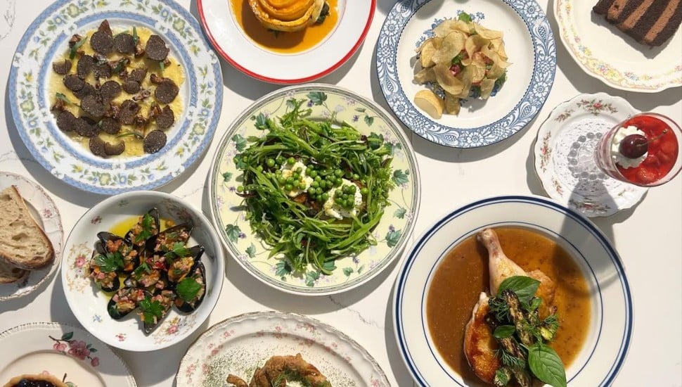 A table covered with entree dishes from restaruants.